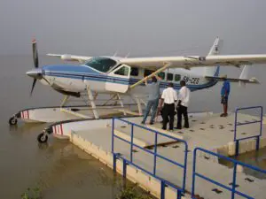 A small airplane is parked on the dock.