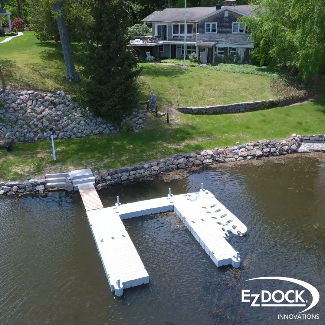 A boat dock with a ramp and mooring system.