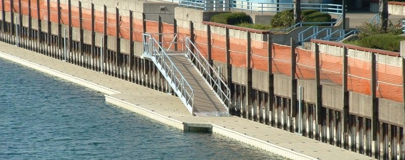 A metal staircase going down the side of a dock.