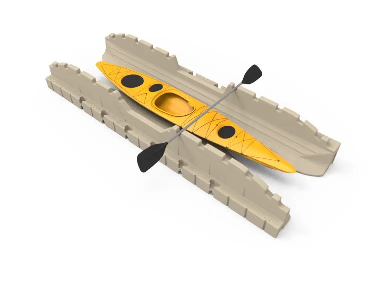 A yellow kayak with two oars on top of it.