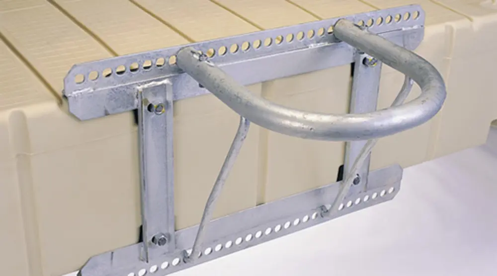A close up of the side rails on a metal frame